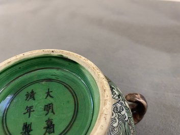 A Chinese verte biscuit 'flaming horses' censer, Jiajing mark, 18/19th C.